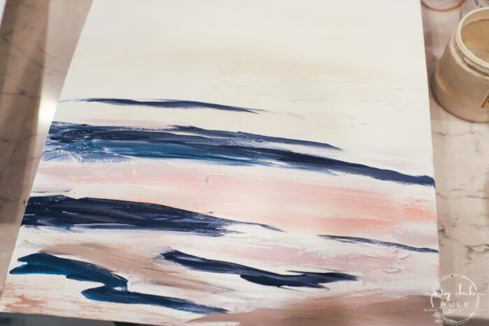 first step when painting abstract beach art with navy, pink and brown colors
