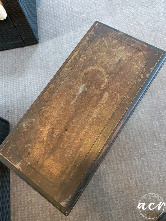 book table top stained and worn