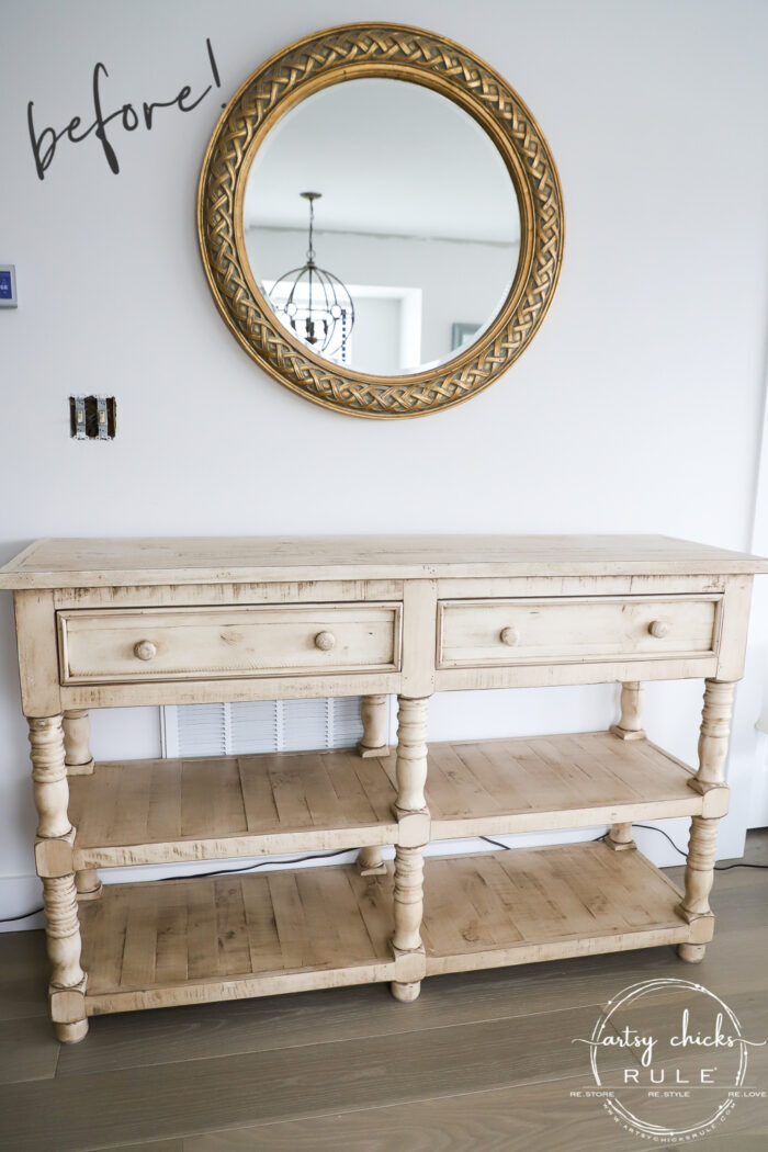 yellow console table round mirror on wall