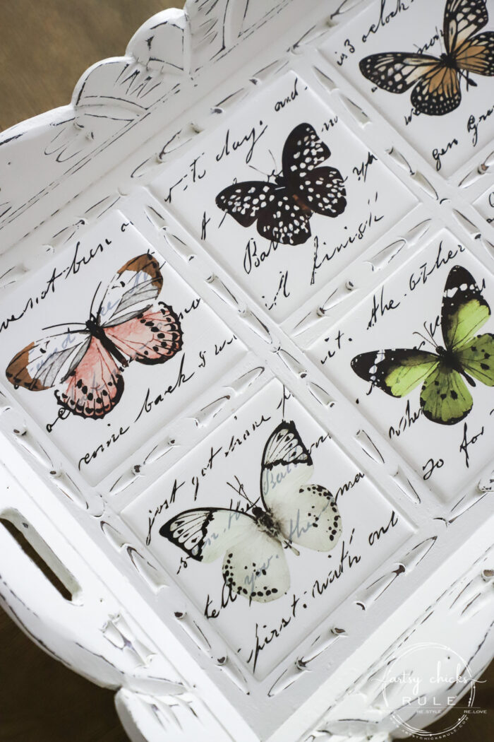 white tray with butterflies and french writing