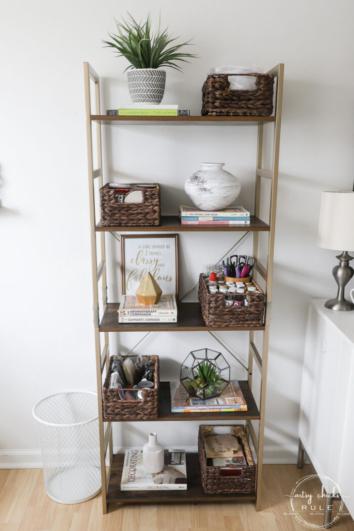 bookcase with baskets and books