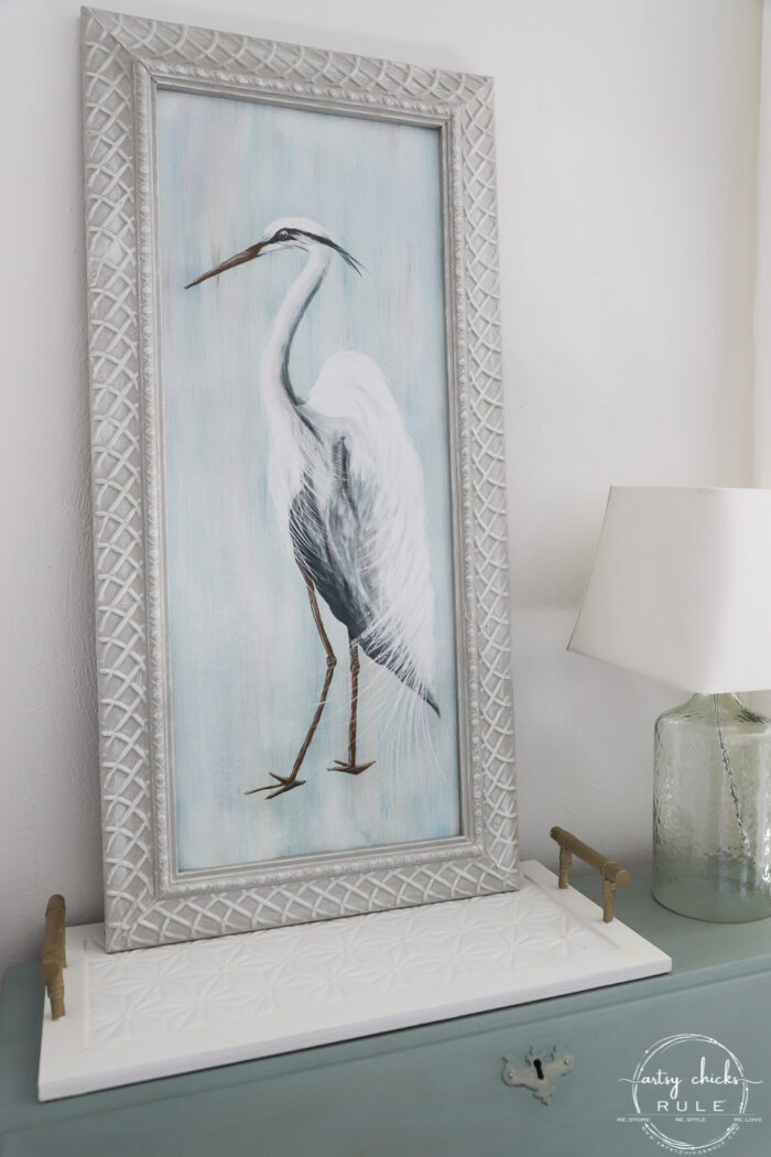blue heron painting on desk with lamp
