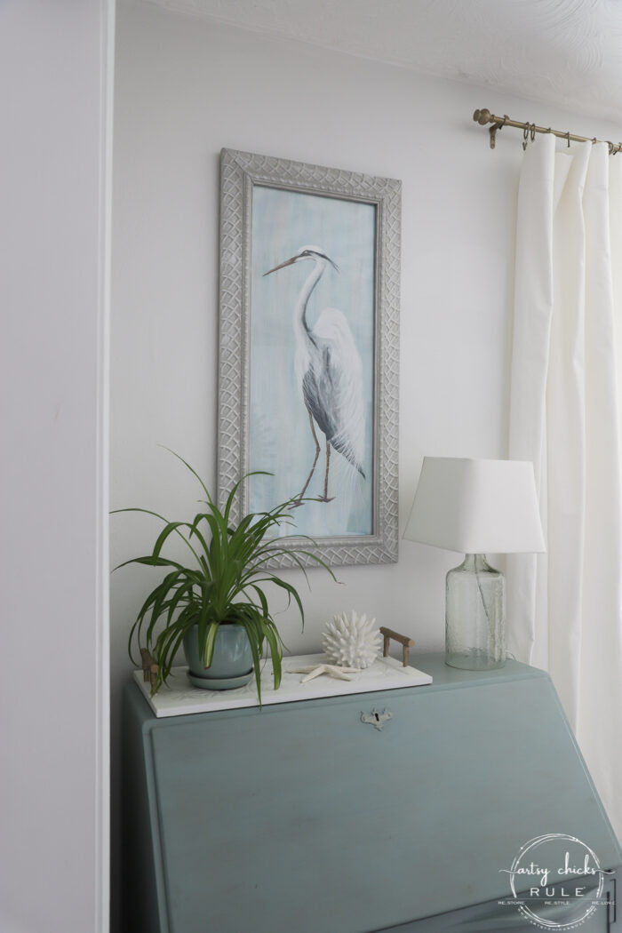blue heron painting on wall