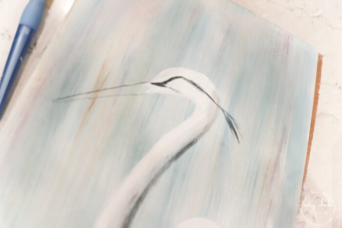 painting eye area of blue heron