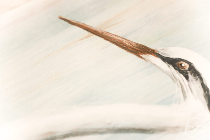 painted in blue heron beak