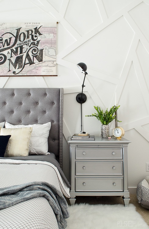 modern bedroom with white abstract wood wall and silver nightstand