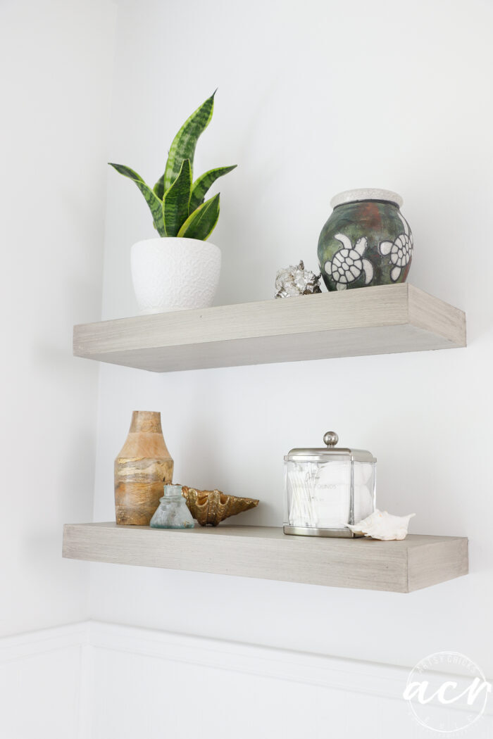 floating wall shelves with green plant and decor