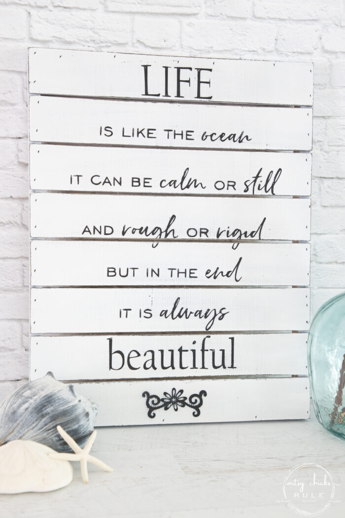 black and white sign with ocean quote