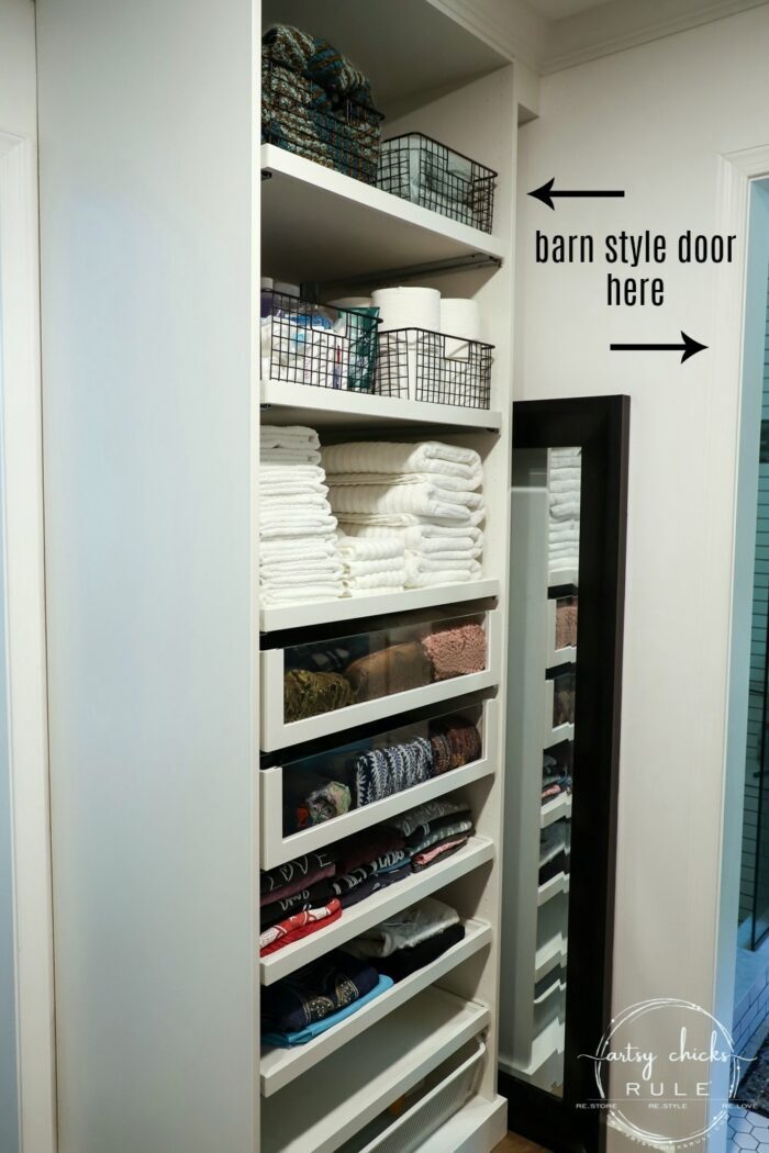 We created a "custom, built-in" master closet look with basic IKEA PAX closet system cabinets simply by adding trim and a few extra touches! artsychicksrule.com #builtincloset #ikeapax #paxclosethack #ikeapaxideas