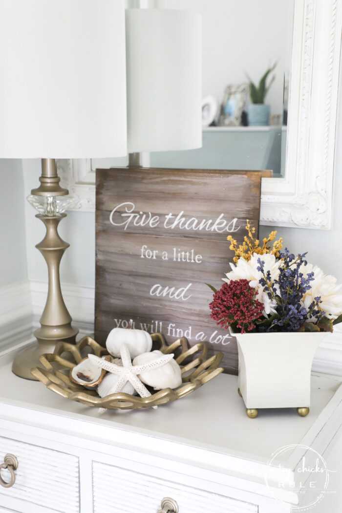 give thanks sign on entry table with small ivory dish filled with flowers