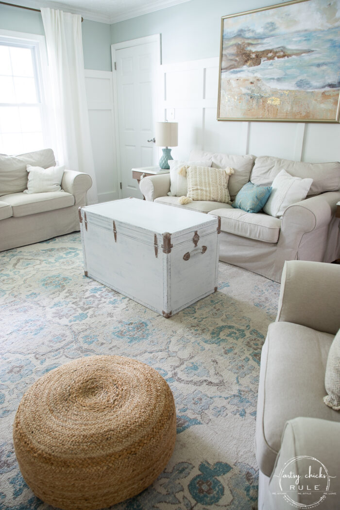 finished white trunk in aqua and neutral colored living room
