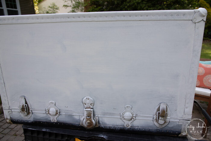 black trunk with white paint