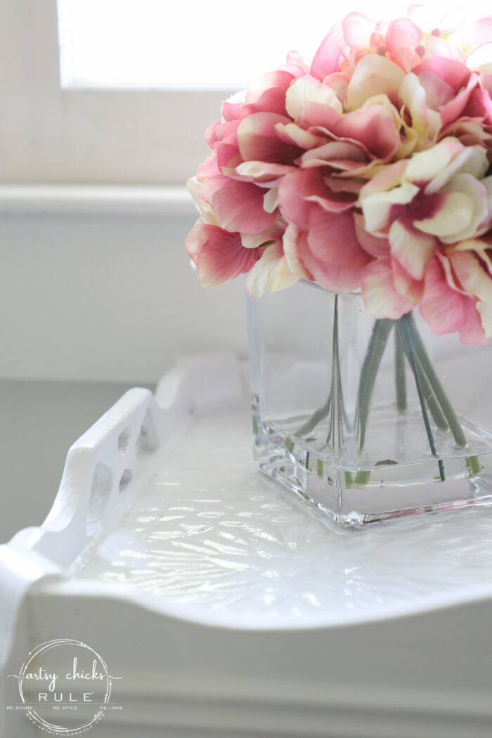 white painted tile table with pink flowers