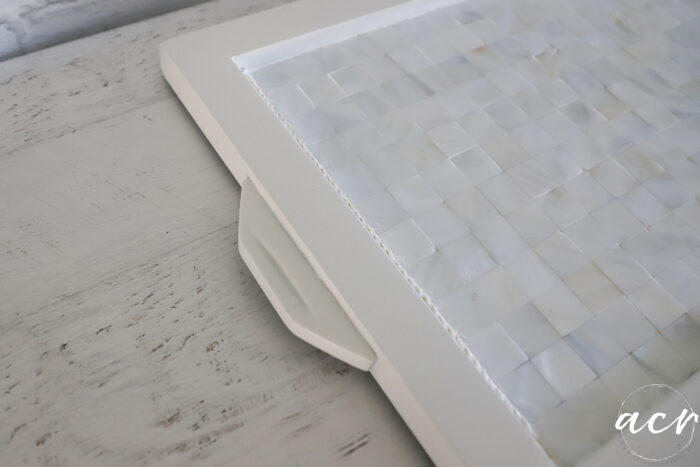side of white tiled tray handle