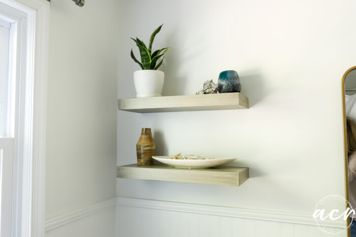 wood look shelves decorated on white wall